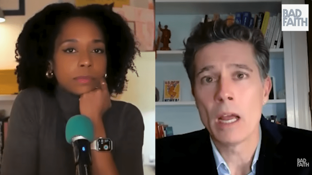 Screenshot from Bad Faith episode on YouTube, with a pensive Briahna Joy Gray. leaning her chin on her fist, on the left side of split screen, listening to guest Gabriel Rockhill speaking on the right.